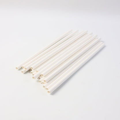 Eco-friendly paper straws displayed with green leaf, highlighting sustainable use
