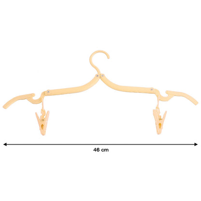 Close-up of dual clips on an adjustable folding clothes hanger
