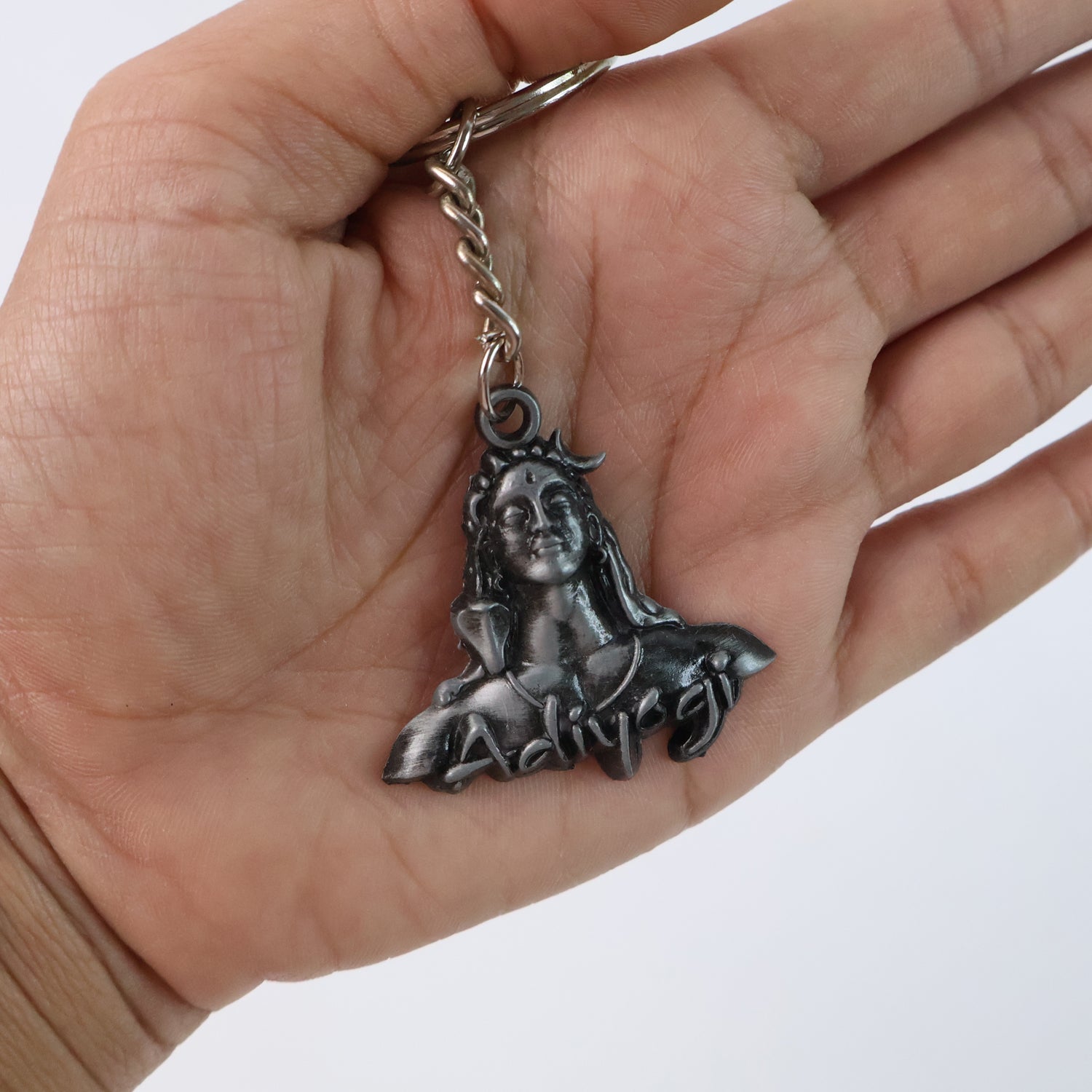 Close-up of Shiva Face Metal Keychain showing intricate craftsmanship