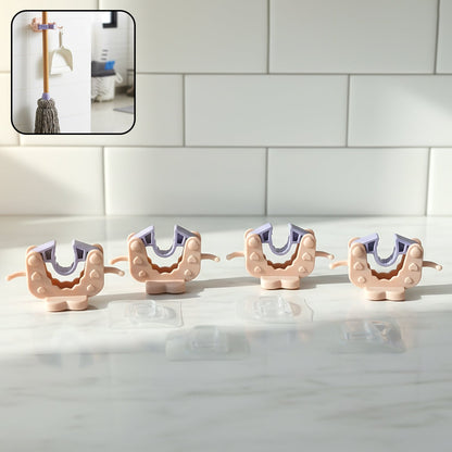 Close-up view of wall mounted broom and mop holder clip