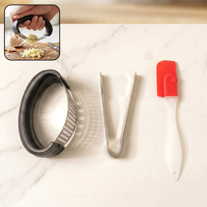 3-in-1 kitchen tool set showing garlic crusher, food tongs, and silicone spatula