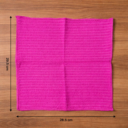 Microfiber cleaning cloth in use wiping a smooth surface