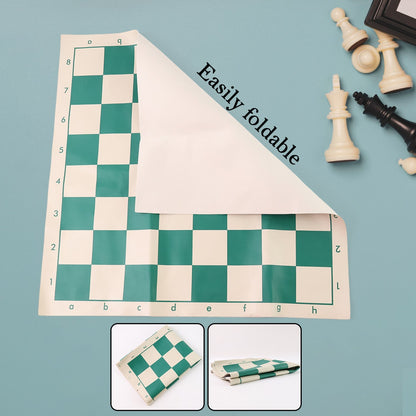 Portable vinyl chessboard spread out with plastic chess pieces arranged