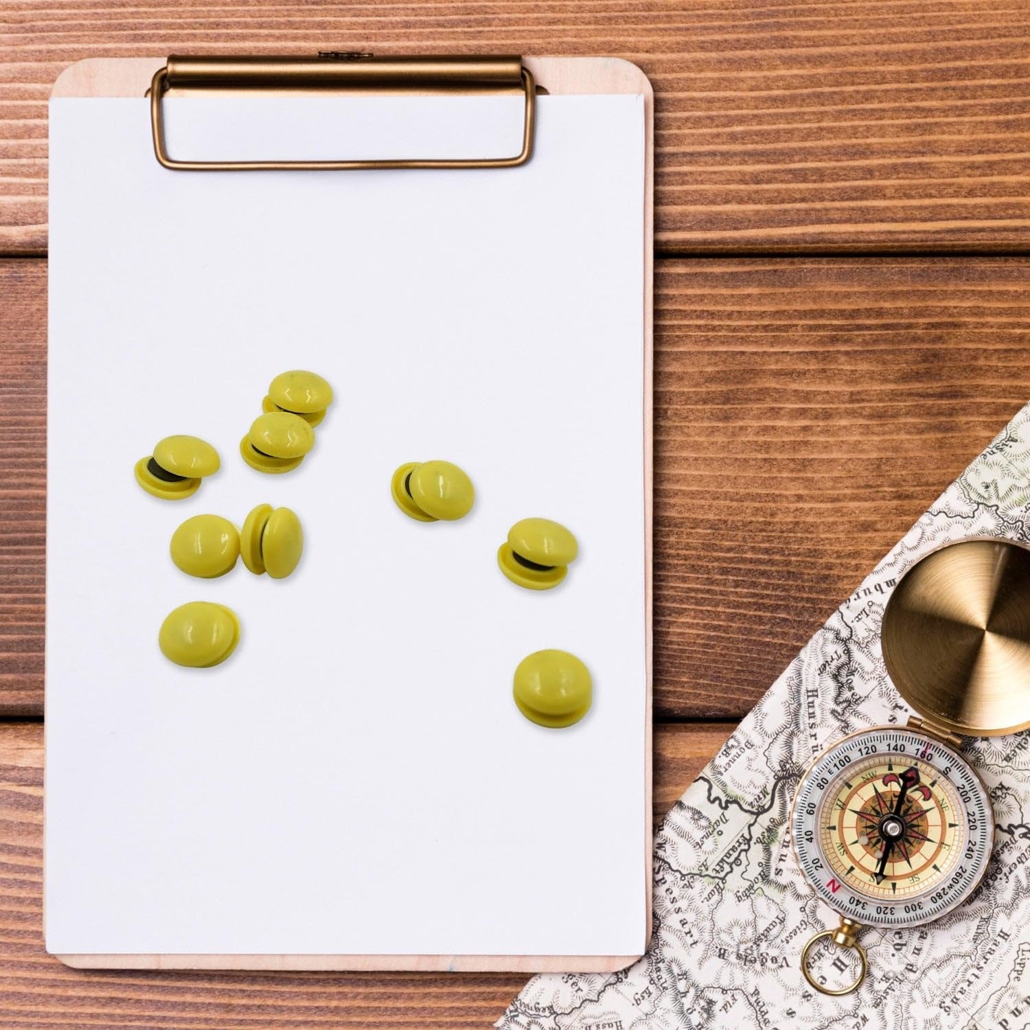 Hand demonstrating the easy grip of a round whiteboard magnet for quick placement.