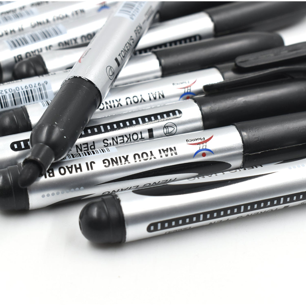 Hand holding an InkGlow Permanent Black Marker for smooth writing.