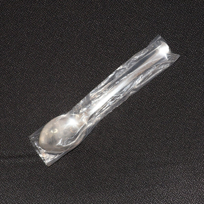 Stainless Steel Dining Spoon alongside other cutlery, ideal for home or café use.