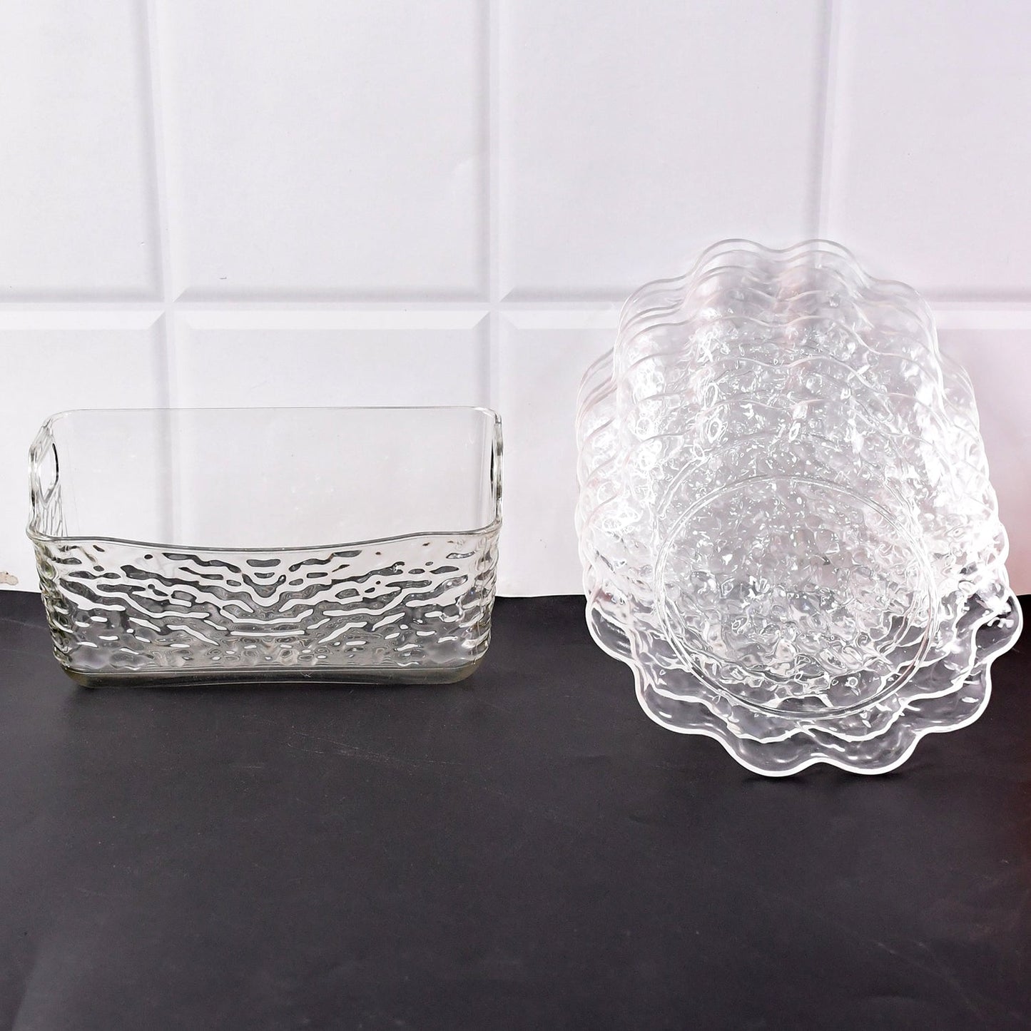 Elegant plastic bowls with textured finish arranged on serving tray