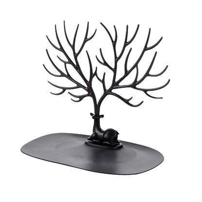 Jewellery display stand with deer antler design holding earrings