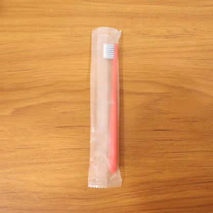 Child-friendly soft bristle toothbrush with ergonomic handle