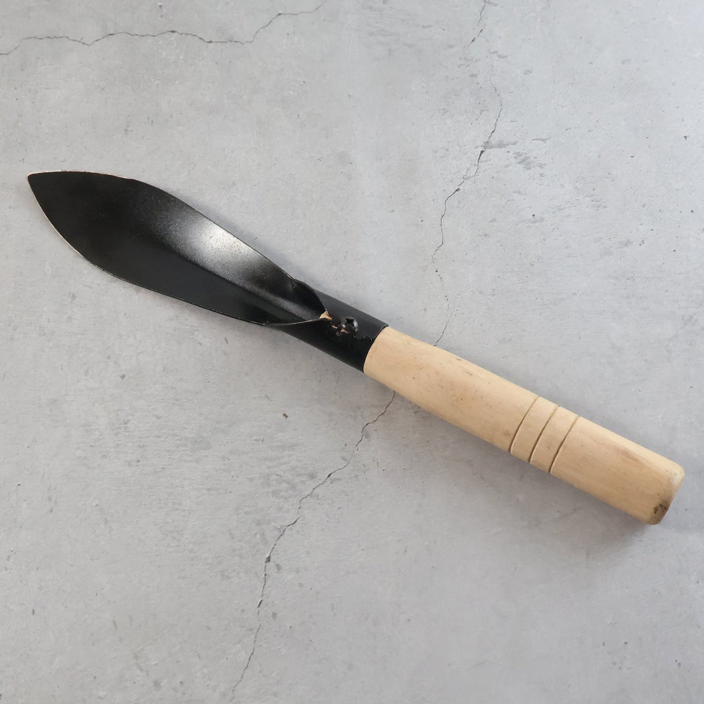 Gardening trowel ideal for soil work in home gardens and landscapes