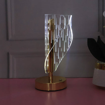 Close up of warm glowing crystal LED table lamp
