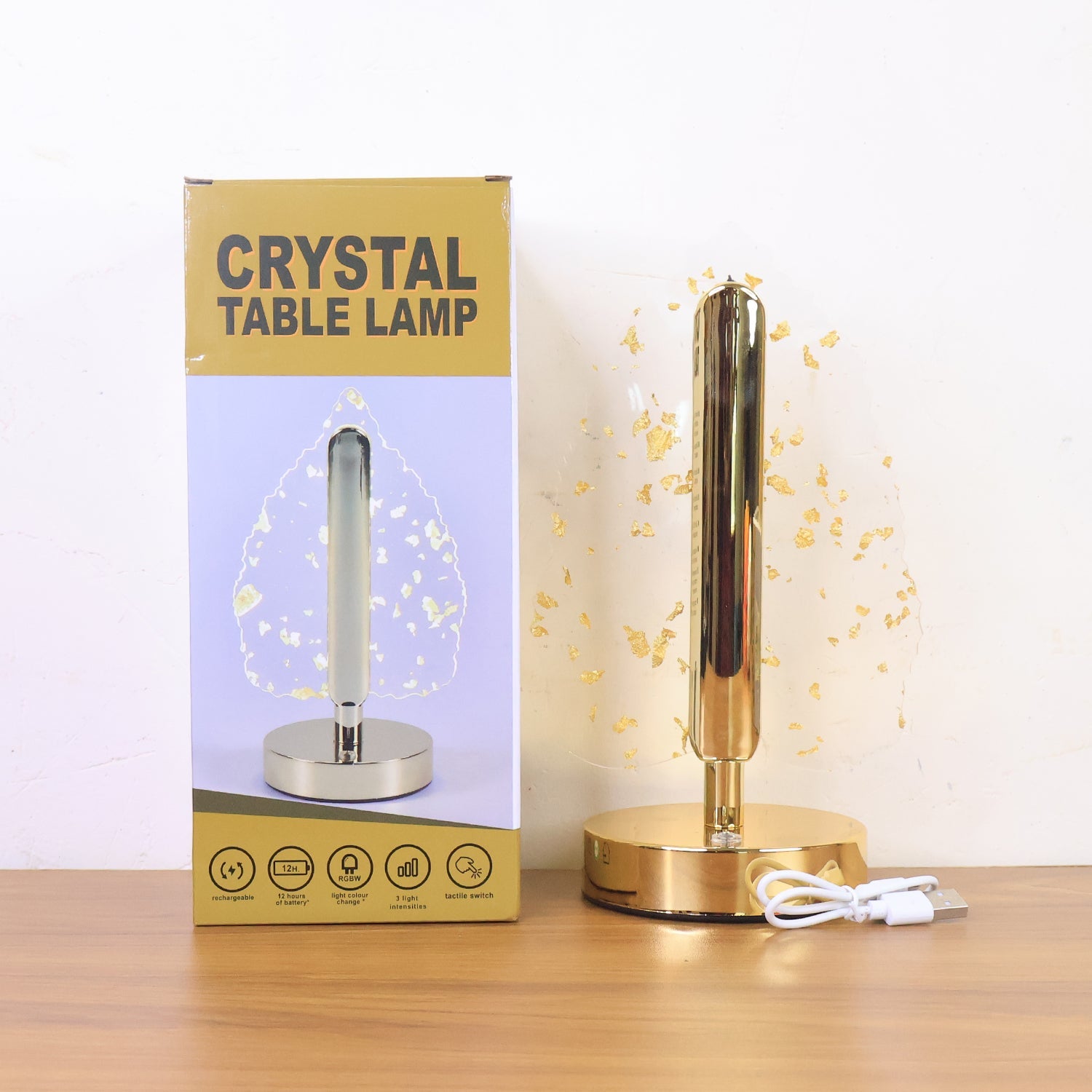 Lifestyle photo of golden crystal leaf LED desk lamp during evening lighting