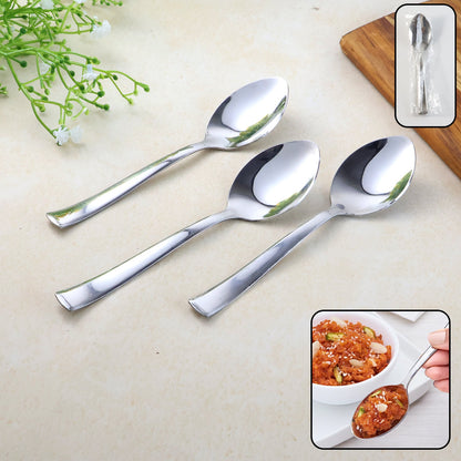 Set of three stainless steel everyday dining spoons on white background