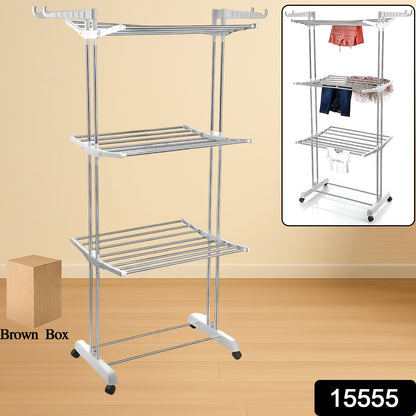 Stainless steel foldable drying rack with clothes drying on its three tiers.