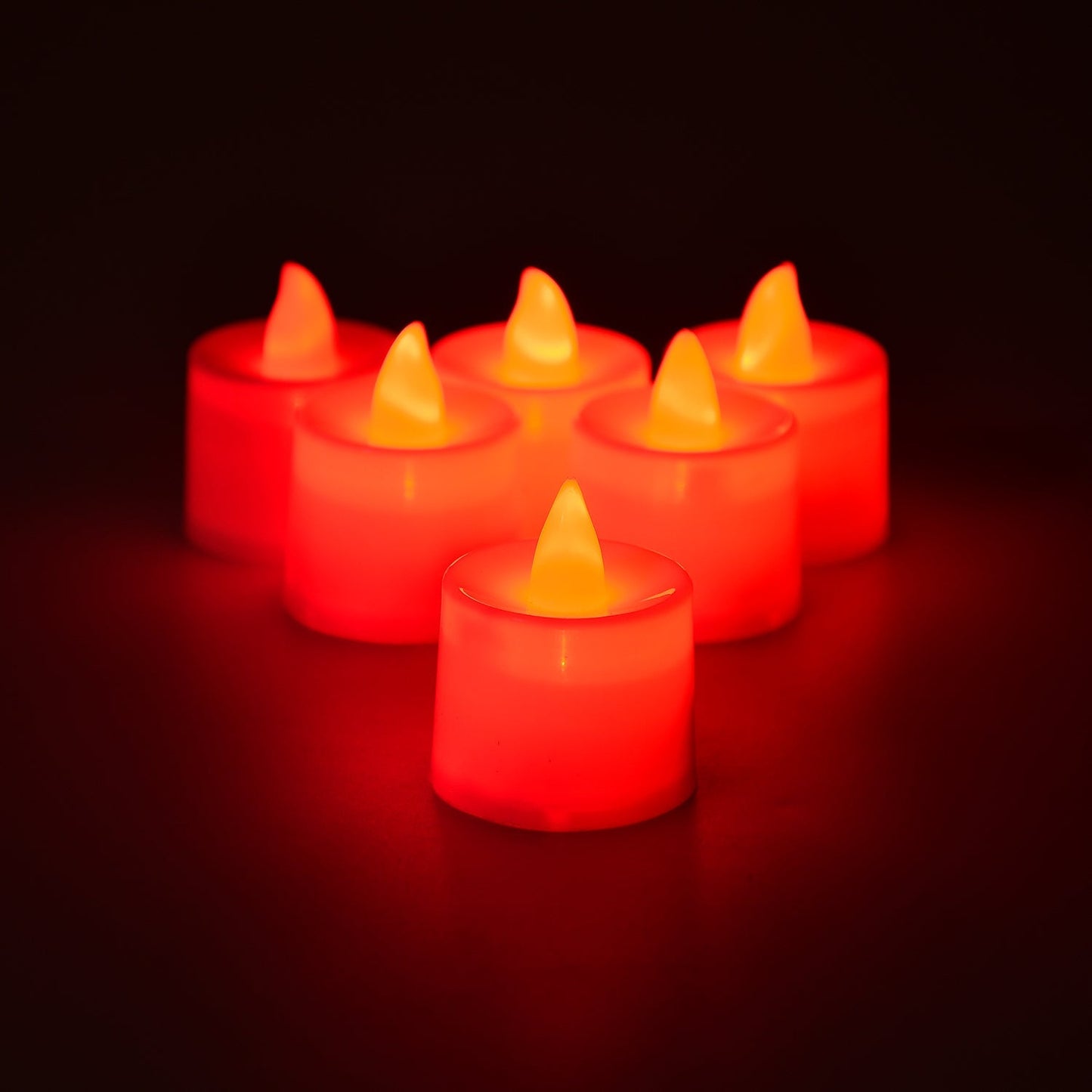 Close-up image showing flickering effect of red LED flameless tealight candle