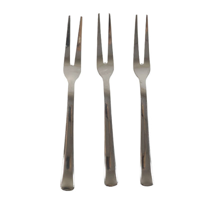 Three small appetizer forks laid out for serving snacks