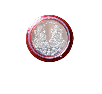 Pooja Coin with packaging displayed on ceremonial cloth