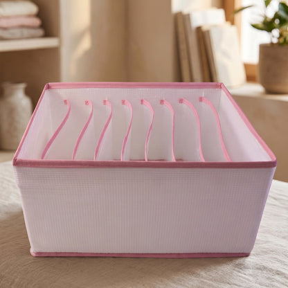 Foldable clothes organizer in use with clothes stored in compartments