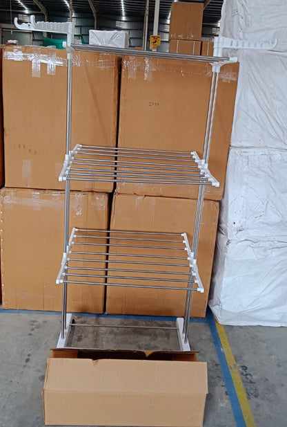 Lifestyle image of the cloth drying stand in a bright, airy laundry space.