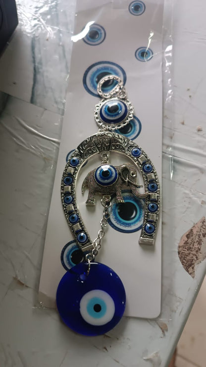 Evil eye charm wind chime with horseshoe design for home and car decor