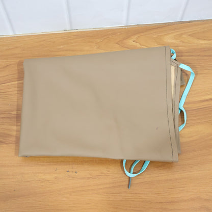 Close-up view of durable apron fabric and stitching