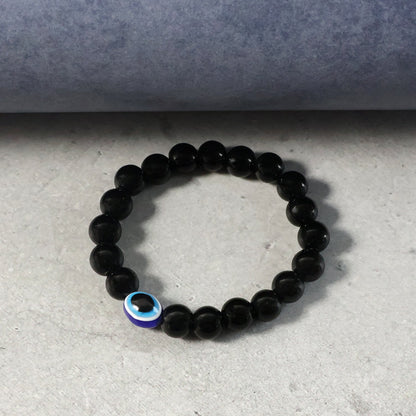 Close-up detail of elegant dual-tone beads on beaded stretch bracelet