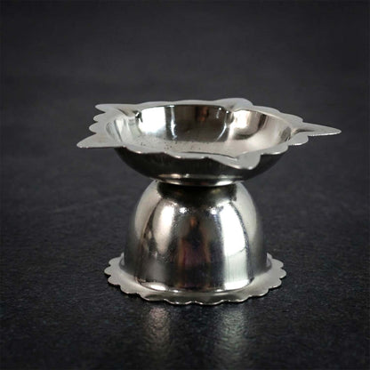Durable stainless steel diya holder with traditional sunflower design