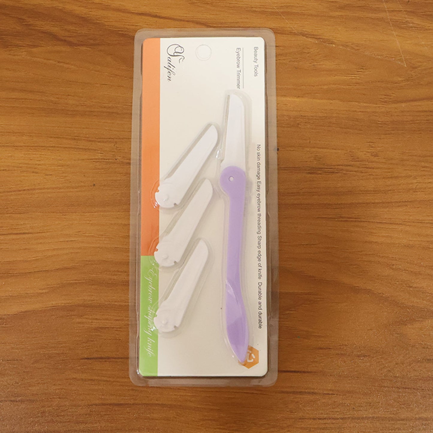Compact facial grooming razor designed for precision eyebrow care