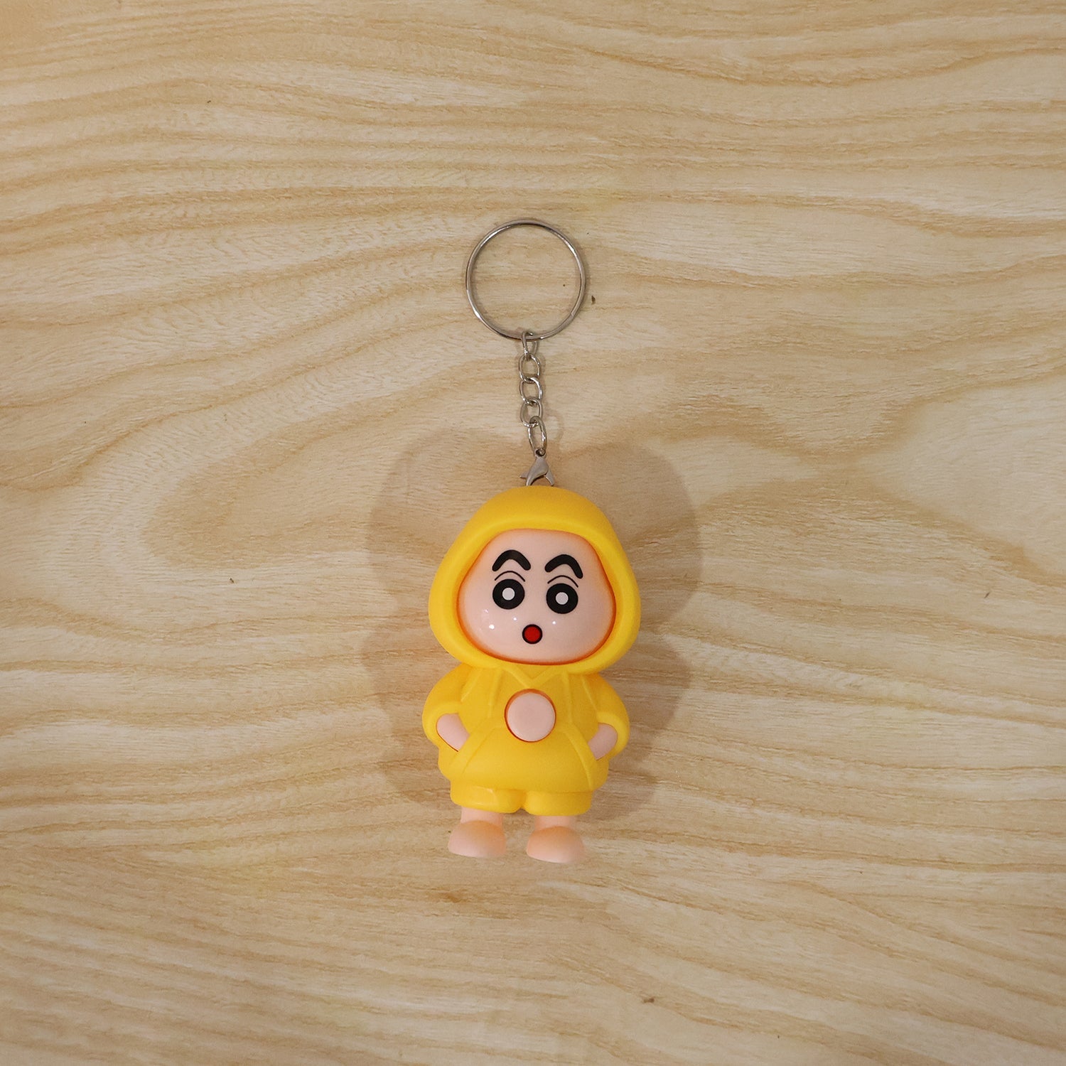 In-use image of face-changing doll keychain attached to backpack