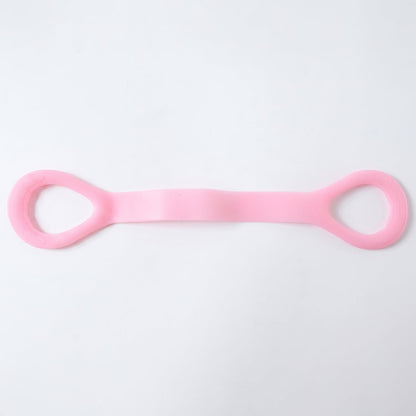Woman using resistance band for arm exercises during workout