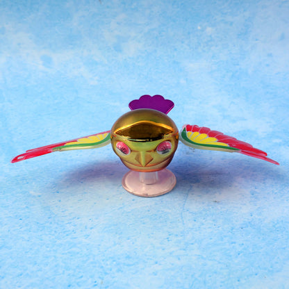 Side view of wind flying bird dashboard accessory showing wing detail