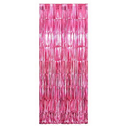 Foil fringe curtain used as an attractive metallic party backdrop for celebrations.