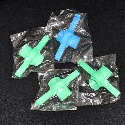 Multiple Food Pouch Sealer Clips in various colours on a kitchen counter.