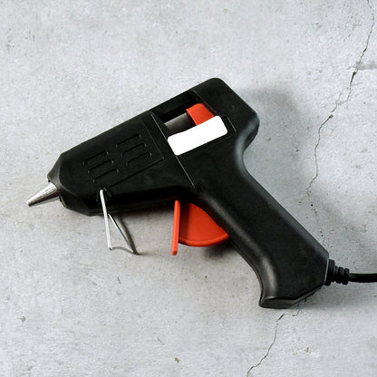 Side angle of electric 20W hot melt glue gun with fold-out stand