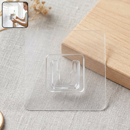 Self-adhesive transparent wall hook on a white background.