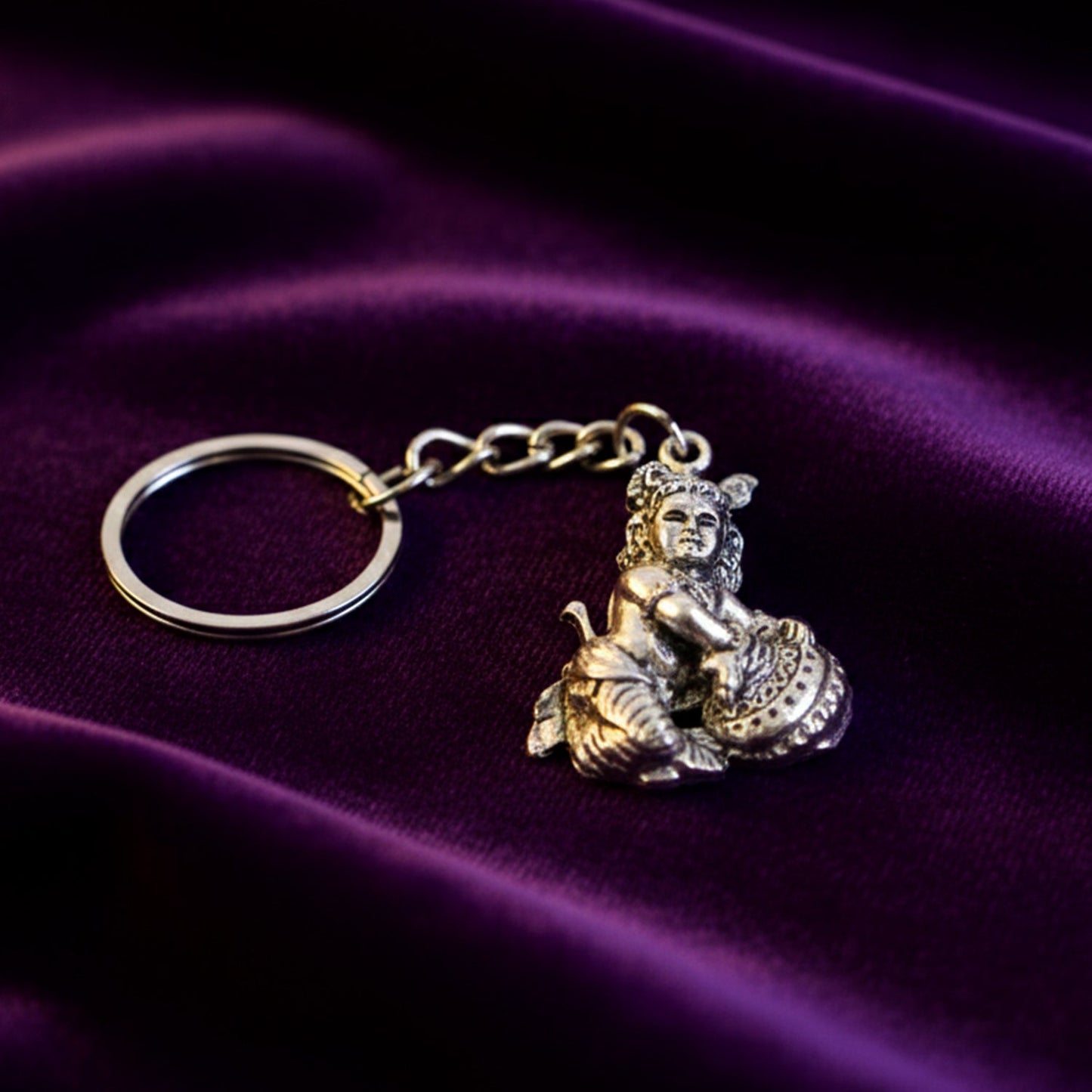 Bal Krishna Makhan Chor keychain attached to a set of everyday keys