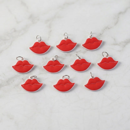 Close-up of vibrant red lips bag charm on a purse