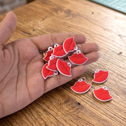 Set of fashionable lips bag charms and keyrings displayed together