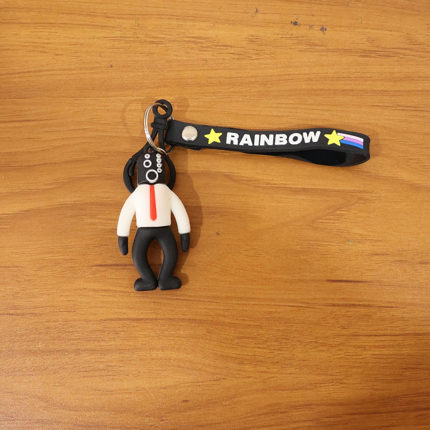 Cartoon man keychain displayed on backpack as accessory enhancing look