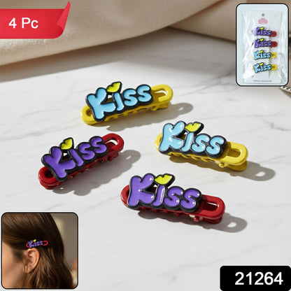 Pack of four Kiss text hair clips with packaging visible