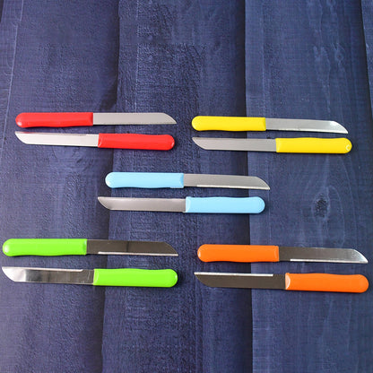 Variety of stainless steel knives with colorful plastic handles for kitchen use