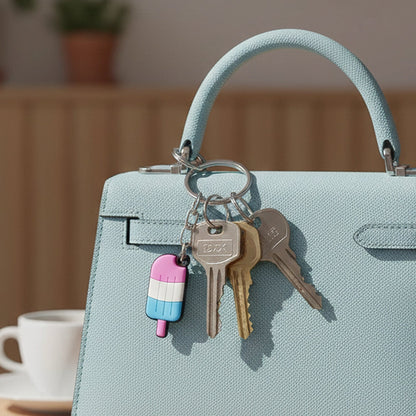 Close-up of popsicle-shaped colorful cartoon key holder with metal ring