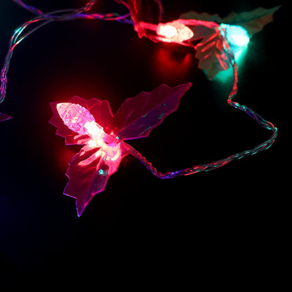 Close view of multicolor LED bulbs on decorative leaf string light
