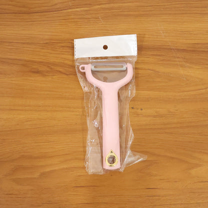 Ergonomic vegetable peeler in use peeling fresh fruits and vegetables smoothly