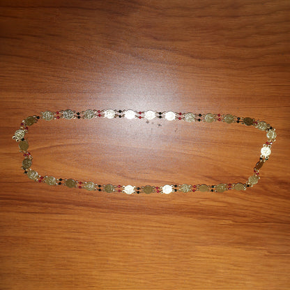 Traditional statement gold tone coin necklace worn with ethnic outfit