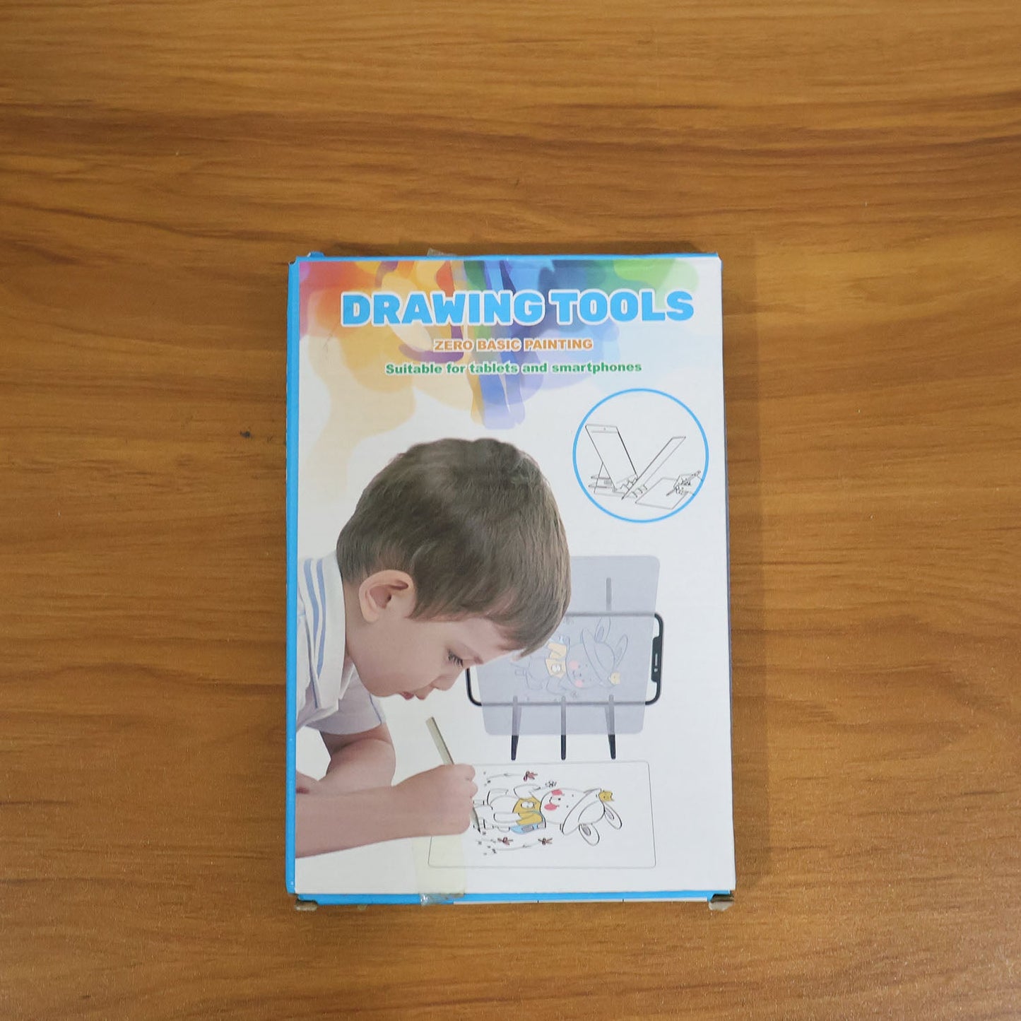 Kids using the mobile phone drawing projector board for sketching and tracing