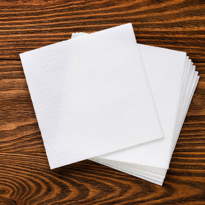 White disposable napkins ideal for restaurant and catering services.