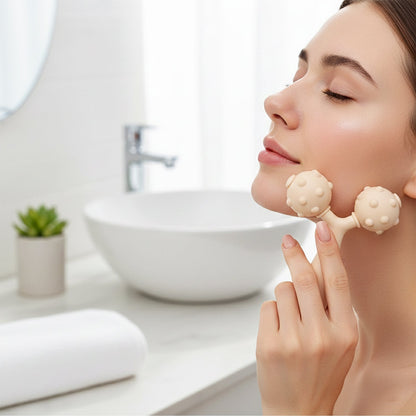 Facial massager with dual rolling balls for improved skin elasticity