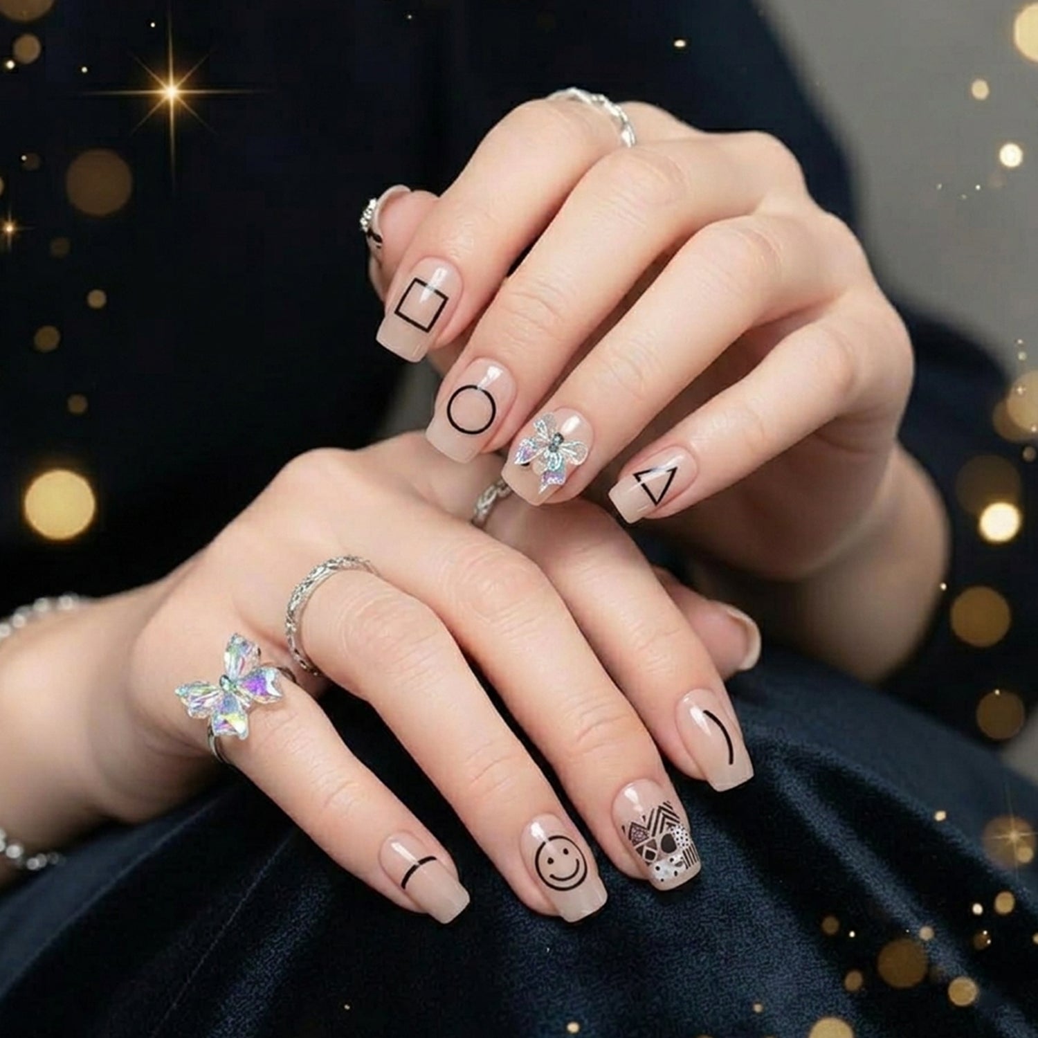 Close-up of stylish glossy false nails with a trendy design.