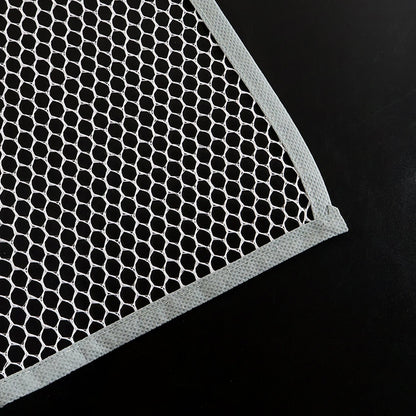 Hand holding the lightweight Large Ironing Press Net mesh protector cloth